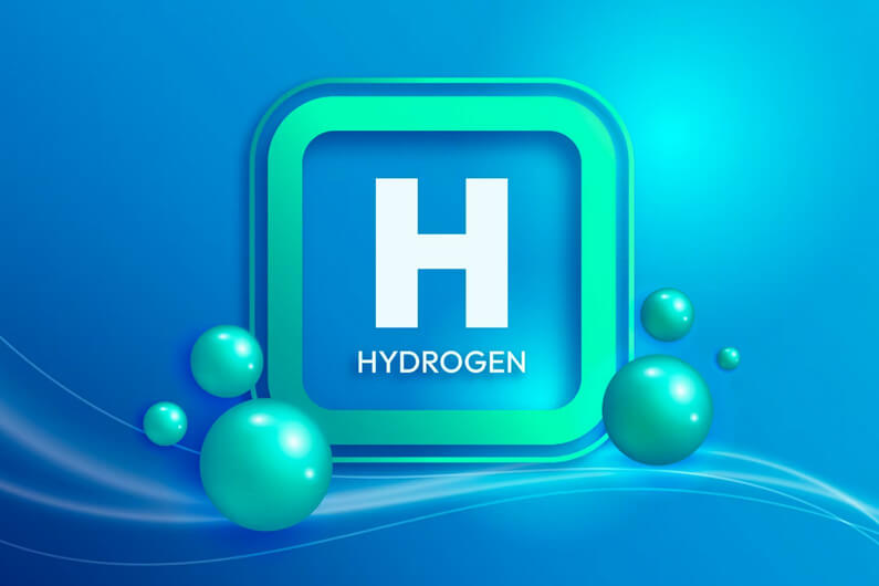 Imagem do símbolo químico do hidrogênio para ilustrar post sobre a revolução do hidrogênio verde via eletrólise.